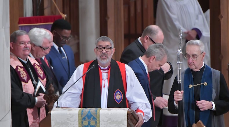 Bishop Robert Wright of the Episcopal Diocese of Atlanta, shown at an Inauguration Day prayer service in 2019, said churches can cancel all worship services for the next two weeks or practice extreme caution amid the coronavirus threat. HYOSUB SHIN / HSHIN@AJC.COM