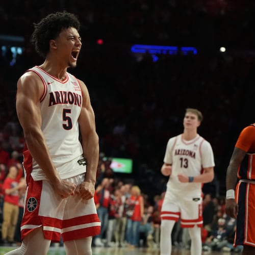 Arizona guard Brayden Burries (5) reacts after scoring against Auburn during the second half of an NCAA college basketball game, Saturday, Dec. 6, 2025, in Tucson, Ariz. (AP Photo/Rick Scuteri)