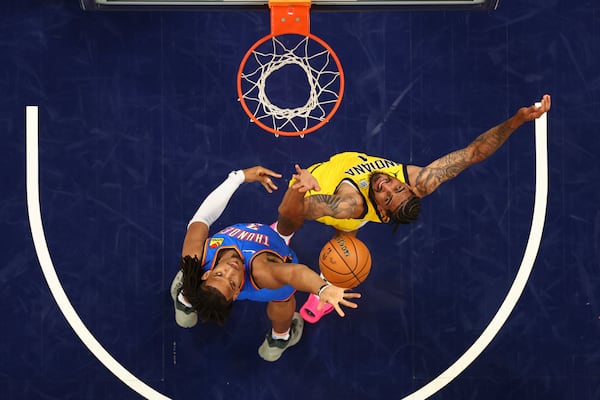 Oklahoma City Thunder forward Dillon Jones (3) Indiana Pacers forward Obi Toppin (1) fight for a rebound during the second half of Game 6 of the NBA Finals basketball series, Thursday, June 19, 2025, in Indianapolis. (Maddie Meyer/Pool Photo via AP)