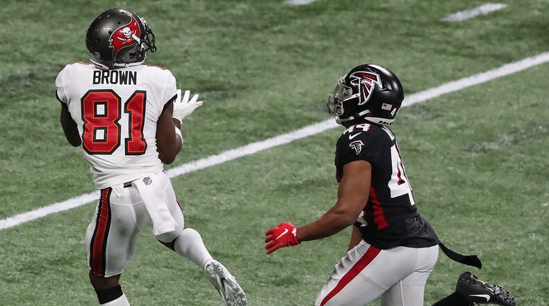Tampa Bay Buccaneers wide receiver Antonio Brown gets past Atlanta Falcons cornerback Tyler Hall for what proved to be the game-winning touchdown for a 31-27 lead in the final minutes of a come from behind victory on Sunday, Dec. 20, 2020, in Atlanta, Georgia. (Curtis Compton/Atlanta Journal-Constitution/TNS)