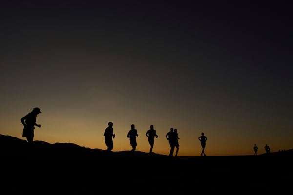 Danny Westergaard, leading the center group of runners, competes during the Badwater 135 Ultramarathon, Monday, July 7, 2025, near Badwater Basin in Death Valley National Park, Calif. (AP Photo/John Locher)