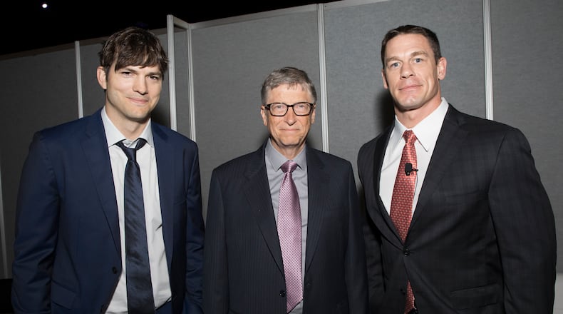 Ashton Kutcher, Bill Gates and John Cena at the Rotary International annual international meeting, which is being held in Atlanta. On Monday, the Gates Foundation and Rotary committed $450 to eradicate polio.