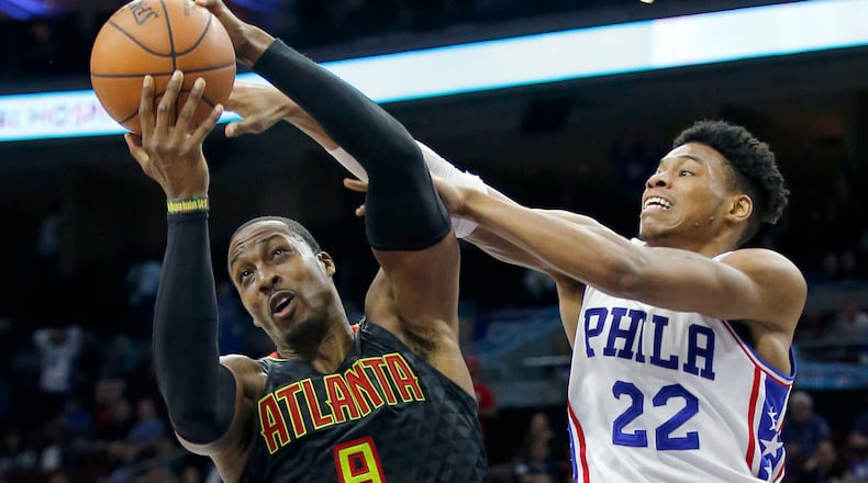The Atlanta Hawks’ Dwight Howard (8) tries to fend off the Philadelphia 76ers’ Richaun Holmes (22) during the fourth quarter on Wednesday, March 29, 2017, at the Wells Fargo Center in Philadelphia. The Hawks won, 99-92. (Yong Kim/Philadelphia Daily News/TNS)