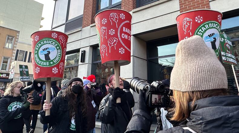Starbucks employees and supporters picket outside a Starbucks store in the Brooklyn borough of New York, Monday, Dec. 1, 2025 (AP Photo/Jennifer Peltz)
