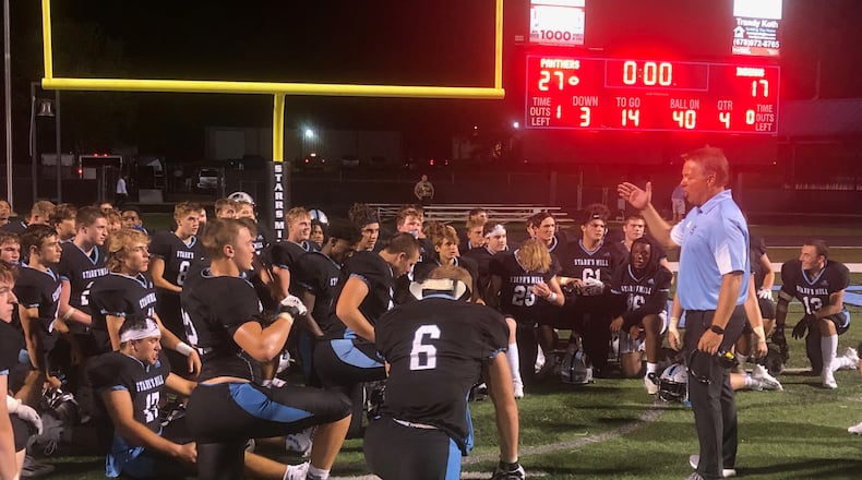 The Starr's Mill players listen to the postgame comments from coach Chad Phillips after their 27-17 win over East Coweta.