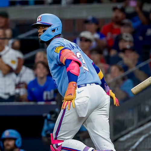 Atlanta Braves' Ronald Acuña Jr. (13) flips his bat after hitting a solo home run against the Philadelphia Phillies during the fourth inning of a baseball game, Saturday, Sept. 12, 2026, in Atlanta. (AP Photo/Erik S. Lesser)
