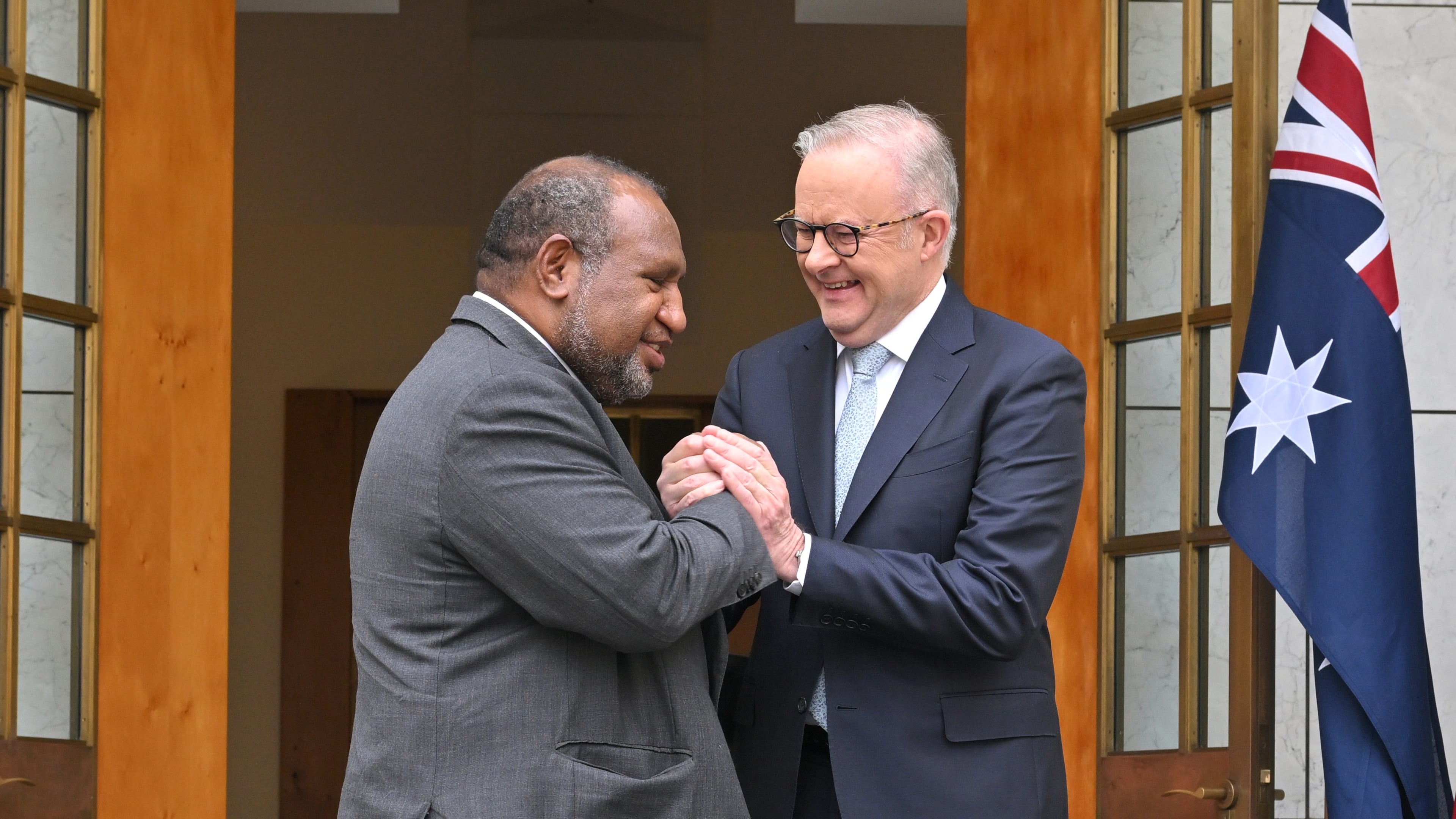 Australia's Prime Minister Anthony Albanese, right, shakes hands with Papua New Guinea's Prime Minister James Marape before signing a defense treaty at Parliament House in Canberra, Australia, Monday, Oct. 6, 2025. (Mick Tsikas/AAP Image via AP)