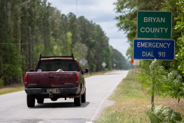 A truck drives down Ash Branch Church Road near Pembroke in the northwest corner of Bryan County. (Ben Gray for the AJC)