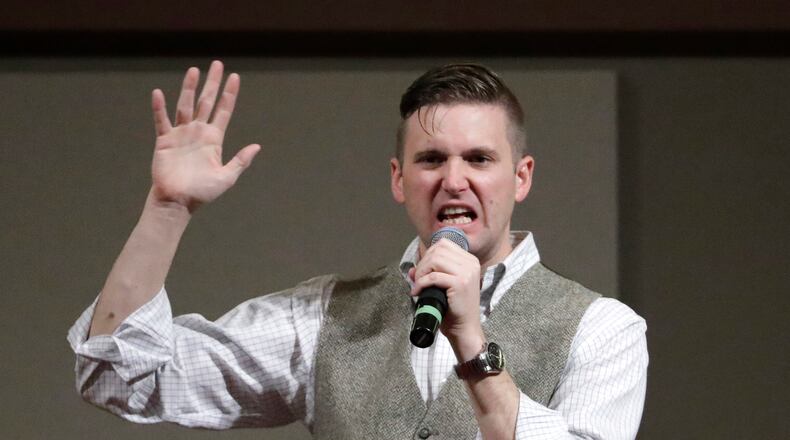 Richard Spencer, who leads a movement that mixes racism, white nationalism and populism, speaks at the Texas A&M University campus in College Station, Texas. The Internal Revenue Service has revoked the tax-exempt status of the National Policy Institute, a group run by Spencer, for its failure to file tax returns for three consecutive years. Spencer told The Los Angeles Times it was an error and that he plans to appeal. (AP Photo/David J. Phillip, File)
