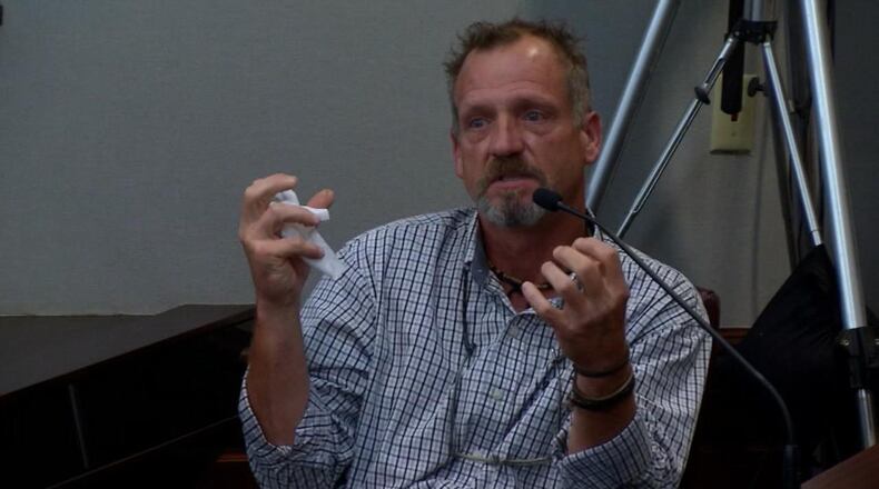 James Hawkins, a lighting installer from Kennesaw, gets emotional as he describes trying to administer CPR on Cooper Harris during Justin Ross Harris' murder trial at the Glynn County Courthouse in Brunswick, Ga., Tuesday, Oct. 4, 2016. Hawkins was working at the Akers Mill Square shopping center when he heard Harris bring his SUV to a screeching halt. (screen capture via WSBTV)