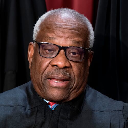 FILE - Supreme Court Associate Justice Clarence Thomas joins other members of the Supreme Court as they pose for a new group portrait, at the Supreme Court building in Washington, Oct. 7, 2022. Thomas was nominated by President George H. W. Bush to succeed Justice Thurgood Marshall and has served since 1991. (AP Photo/J. Scott Applewhite, File)