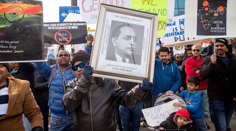 Protesters march along Centennial Olympic Park Drive near CNN Center during the Americans United for Justice in India rally Sunday, January 26, 2020. STEVE SCHAEFER / SPECIAL TO THE AJC