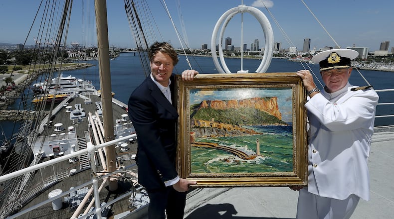Duncan Sandys, left, great grandson of Sir Winston Churchill, and Commodore Everett Hoard hold up a painting done by Sir Winston Churchill, titled, Coast Scene Near Marseilles, 1930’s, an oil on canvas, that will be on exhibit at an art gallery aboard the Queen Mary in Long Beach, Calif. A total of 10 paintings done by Churchill will be included in the exhibit, which runs from May 27, 2016 to December 31, 2016. (Mel Melcon/Los Angeles Times/TNS)