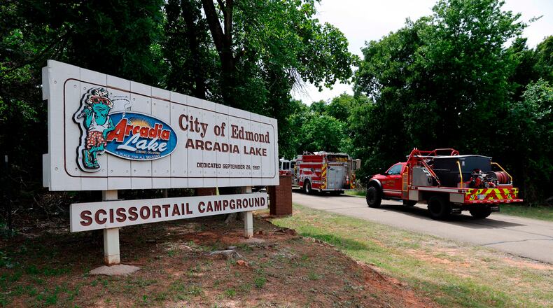 Edmond fire crews enter Scissortail Campground at Arcadia Lake in Edmond, Okla. on Monday, May 4, 2026 after a party shooting on Sunday evening. (AP Photo/Alonzo Adams)