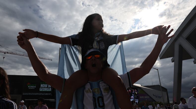 Argentina fans celebrate outside Atlanta Stadium (Mercedes-Benz Stadium) after Argentina wins the FIFA World Cup game between England and Argentina in Atlanta on July 15, 2026. The World Cup brought the world to Atlanta, while giving Nedra Rhone the perfect vehicle for a staycation. (Arvin Temkar/AJC)