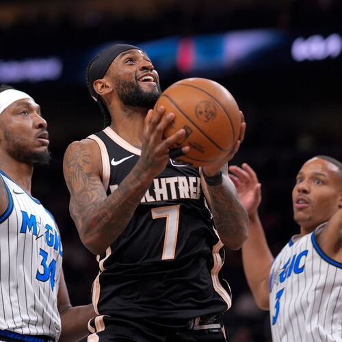 Atlanta Hawks guard Nickeil Alexander-Walker (7) shoots against Orlando Magic guard Desmond Bane (3) during the first half of an NBA basketball game, Monday, March 16, 2026, in Atlanta. (AP Photo/Mike Stewart)