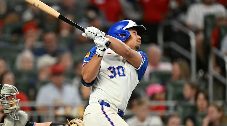 Atlanta Braves catcher Drake Baldwin (30) hits a double during the fifth inning of a baseball game at Truist Park, Saturday, April 5, 2025, in Atlanta. Miami Marlins won 4-0 over Atlanta Braves.(Hyosub Shin / AJC)