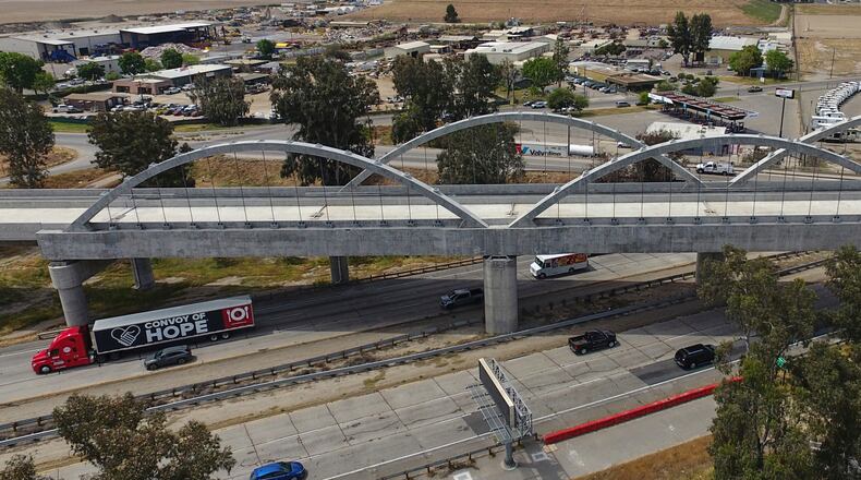 FILE - The Cedar Viaduct, designed to take high-speed trains over Cedar and North avenues and State Route 99, is shown in an aerial view, Tuesday, April 15, 2025, in Fresno, Calif. (AP Photo/Godofredo A. Vásquez, File)