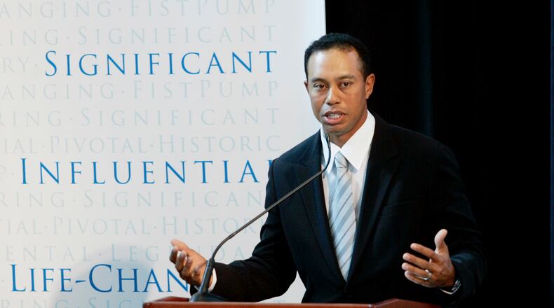 FILE - Golfer Tiger Woods announces the launch of a nationwide youth program called the "Fist Pump Challenge" in Anaheim, Calif., Jan. 21, 2008. (AP Photo/Damian Dovarganes, File)