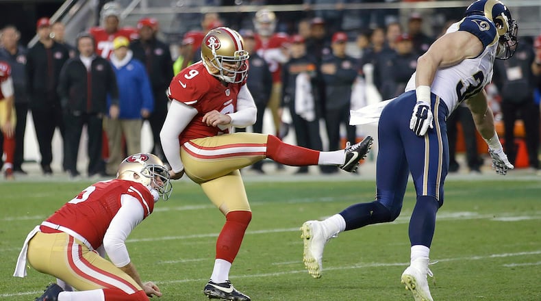 FILE - In this Jan. 3, 2016, file photo, San Francisco 49ers kicker Phil Dawson (9) boots a field goal during overtime of an NFL football game against the St. Louis Rams in Santa Clara, Calif. Veteran kicker Dawson has signed his new one-year contract to stay with the 49ers, after reaching agreement on the deal Friday, March 11, 2016. The team announced the signing Monday. (AP Photo/Marcio Jose Sanchez, File)