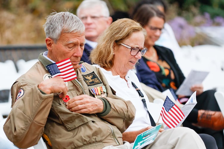 Vietnam veteran Cy Stricker (left) wears an American flag on his jacket at the Veterans Day Commemoration Ceremony at Atlanta History Center on Monday, Nov. 11, 2024, in Atlanta. (Miguel Martinez/AJC 2024)