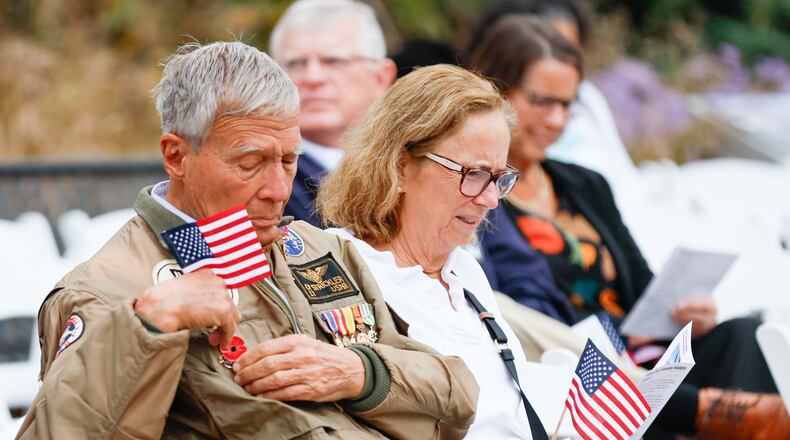 Vietnam veteran Cy Stricker (left) wears an American flag on his jacket at the Veterans Day Commemoration Ceremony at Atlanta History Center on Monday, Nov. 11, 2024, in Atlanta. (Miguel Martinez/AJC 2024)