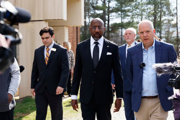U.S. Sen. Raphael Warnock (center) and Social Circle officials spoke out against the detention center after Warnock was given a tour earlier this month of the proposed site and the town's water treatment facilities. (Miguel Martinez/AJC)