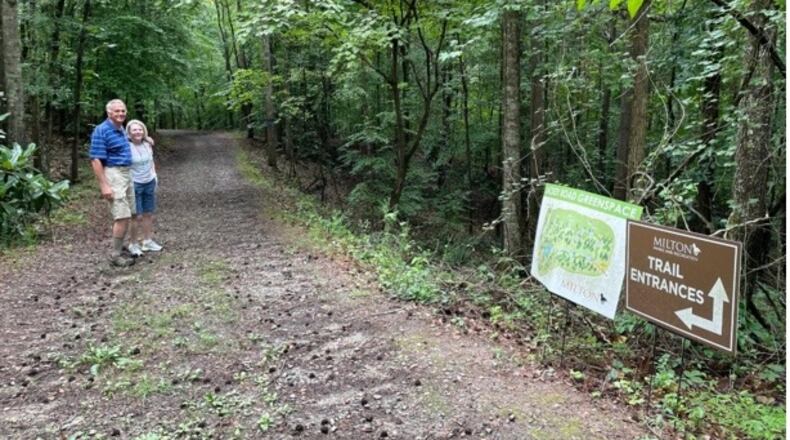 Bernard and Betty Ann Wolff on the 106-acre greenspace off Lackey Road they sold to the city five years ago that will now be known as Lahkapani Preserve. (Courtesy City of Milton)