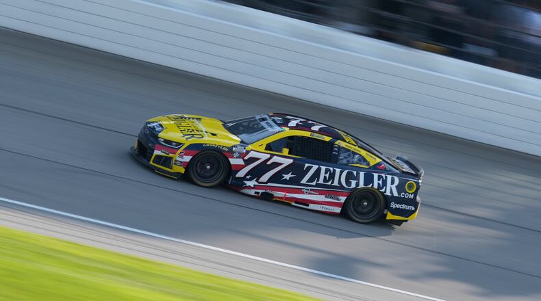 Carson Hocevar (77) drives during a NASCAR Cup Series auto race at Chicagoland Speedway in Joliet, Ill., Sunday, July 5, 2026. (AP Photo/Nam Y. Huh)