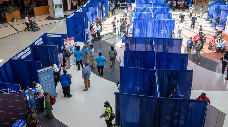 Potential job-seekers stroll through the domestic terminal atrium during the ATL Airport Career Fair at Hartsfield-Jackson Atlanta International Airport last week. (Steve Schaefer / steve.schaefer@ajc.com)