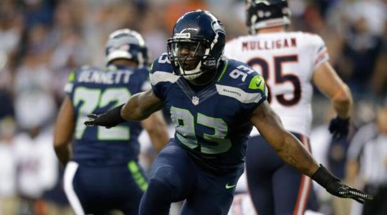 Former Seahawks defensive end O’Brien Schofield here celebrating a sack against the Bears in 2014. Schofield nearly signed with the Giants, last offseason but failed a physical. He's listed as an outside linebacker by the Falcons. JOHN FROSCHAUER — The Associated Press