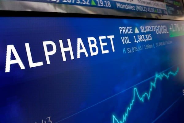 FILE - In this Feb. 14, 2018, file photo the logo for Alphabet appears on a screen at the Nasdaq MarketSite in New York. Alphabet reports earnings on Oct. 24, 2023. (AP Photo/Richard Drew, File)