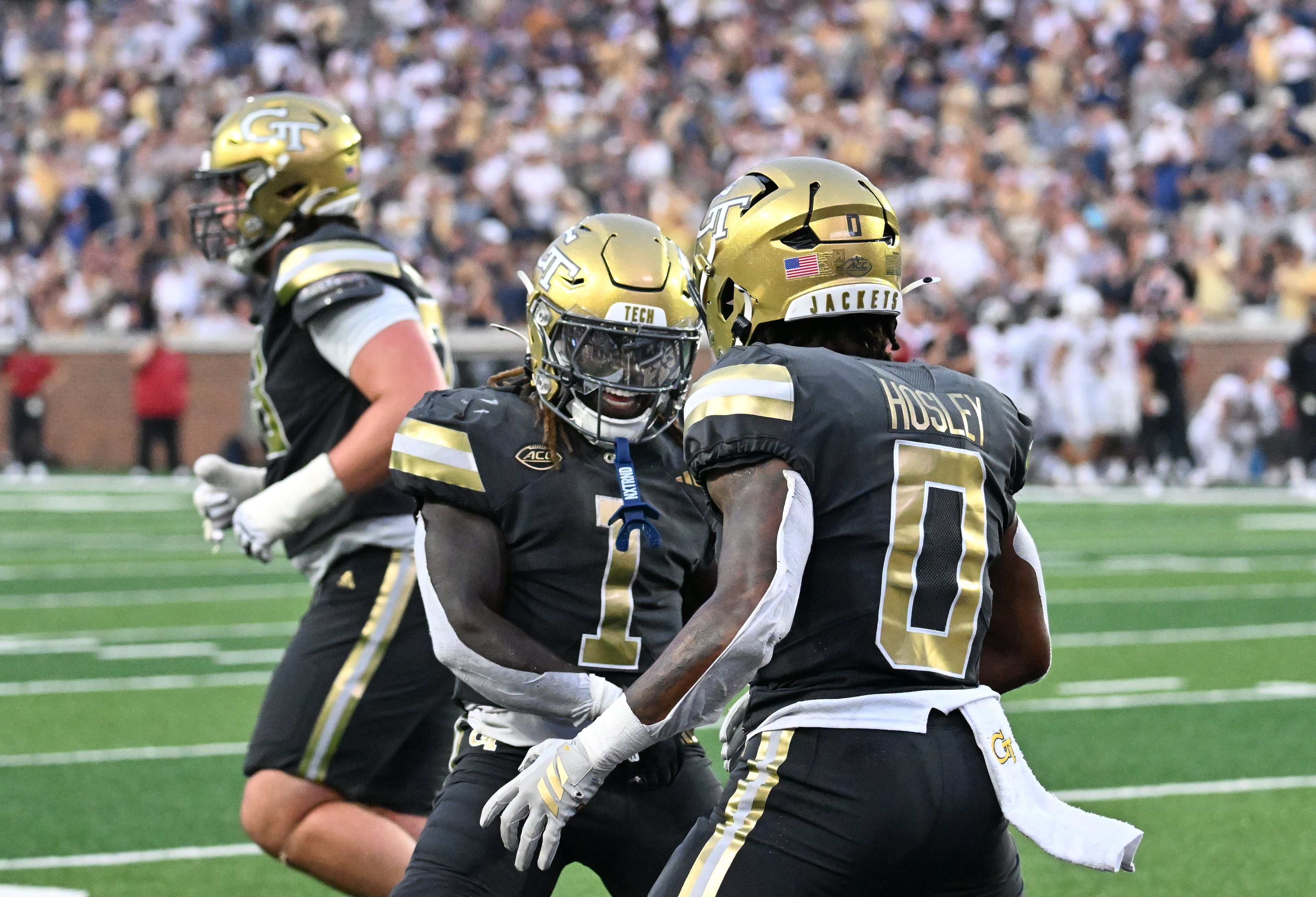 Georgia Tech running back Malachi Hosley (0) celebrates with Georgia Tech running back Jamal Haynes (1) after scoring a touchdown during the second half of an NCAA college football game at Georgia Tech's Bobby Dodd Stadium, Saturday, November 20, 2025 in Atlanta. Georgia Tech won 45-24 over Temple. (Hyosub Shin / AJC)