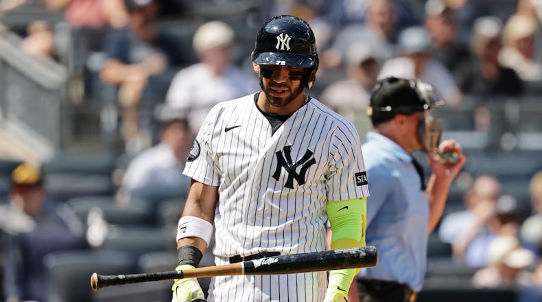 New York Yankees' José Caballero reacts after striking out during an at-bat where he was charged with a pitch-clock violation in the sixth inning during the first baseball game of a doubleheader against the Pittsburgh Pirates, Wednesday, July 22, 2026, in New York. (AP Photo/Adam Hunger)