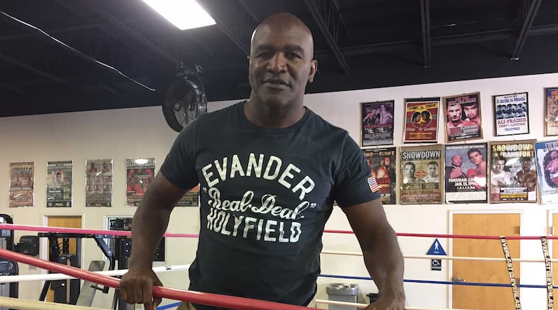 Evander Holyfield, the former longtime Atlanta resident seen in this May 2017 photo, stands in the ring at The Heavyweight Factory in Fort Lauderdale, Fla., where he still works out and shadow boxes.