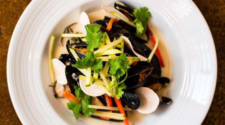 The Alden serves steamed mussels in a fragrant pool of coconut-lemongrass broth, served with mushrooms, cilantro and Thai basil. CONTRIBUTED BY HENRI HOLLIS