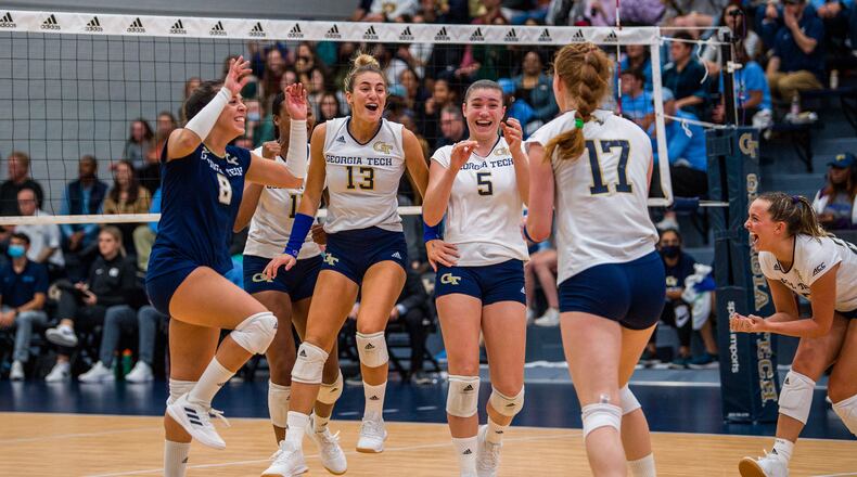 The Georgia Tech volleyball team celebrates during its home win over North Carolina Oct. 29, 2021 at O'Keefe Gymnasium. (Danny Karnik/Georgia Tech Athletics)