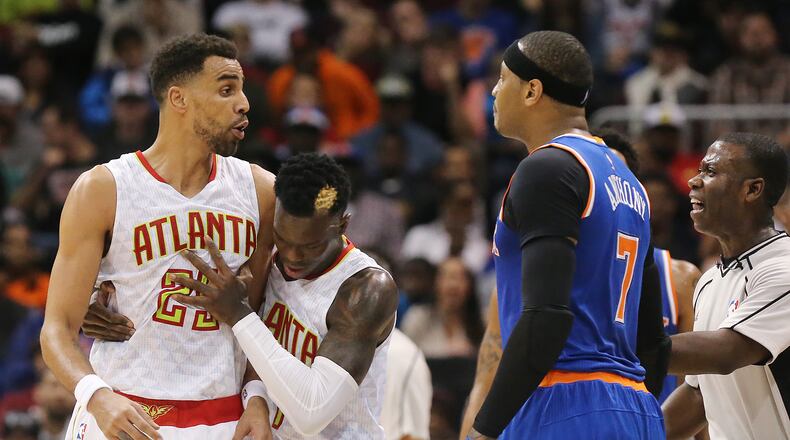 Hawks guard Dennis Schroder and an official separate Thabo Sefolosha and Knicks forward Carmelo Anthony after they were called for a double technical against each other in a NBA basketball game on Wednesday, Dec. 28, 2016, in Atlanta. After a review of the play Anthony was given a flagrant foul 2 and ejected from the game. Curtis Compton/ccompton@ajc.com