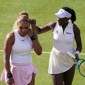 Serena Williams of the United States, left, talks to playing partner Victoria Mboko of Canada as they play against Nicole Melichar-Martinez of Canada and Erin Routliffe of New Zealand during their first round doubles match at the Queen's Club tennis championships in London, Tuesday, June 9, 2026. (AP Photo/Alberto Pezzali)