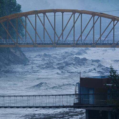 A resident looks at the swollen Trishuli river in Galchhi, Dhading District, Nepal, Sunday, Aug. 30, 2026. (AP Photo/Niranjan Shrestha)