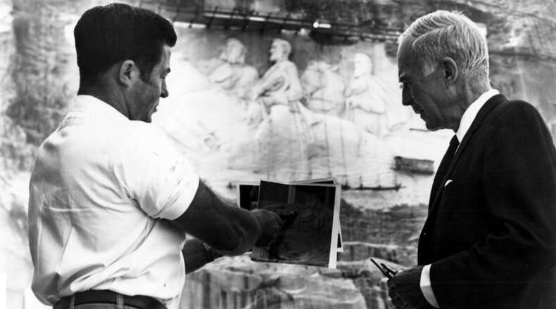 Roy Faulkner, left, joined the Stone Mountain team in 1962 and quickly became chief carver, despite having no artistic training whatsoever. FILE PHOTO