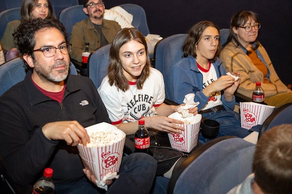 Kyle (from left), Lex, Henry and Sarah Roberts wait to see the “Stranger Things” series finale at the Tara Theatre on Wednesday, Dec. 31, 2025, in Atlanta. (Arvin Temkar/AJC)
