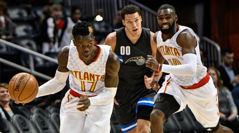 Atlanta Hawks guard Dennis Schroder (17) turns up the floor with a steal as Orlando Magic forward Aaron Gordon (00) and guard Tim Hardaway Jr. (10) pursue during the first half of an NBA basketball game, Saturday, Feb. 4, 2017, in Atlanta. (AP Photo/John Amis)