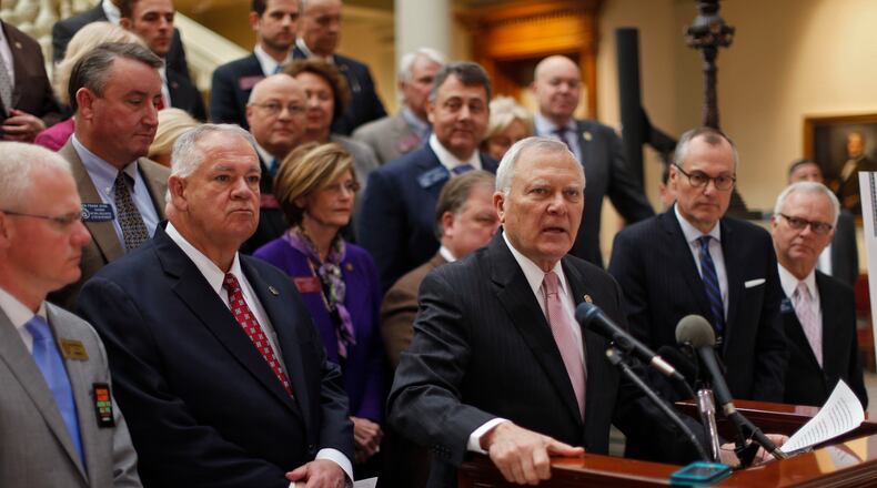 Gov. Nathan Deal, flanked by House Speaker David Ralston on the left and Lt. Gov. Casey Cagle on the right, on Tuesday discusses massive expansion plans for metro Atlanta interstates.