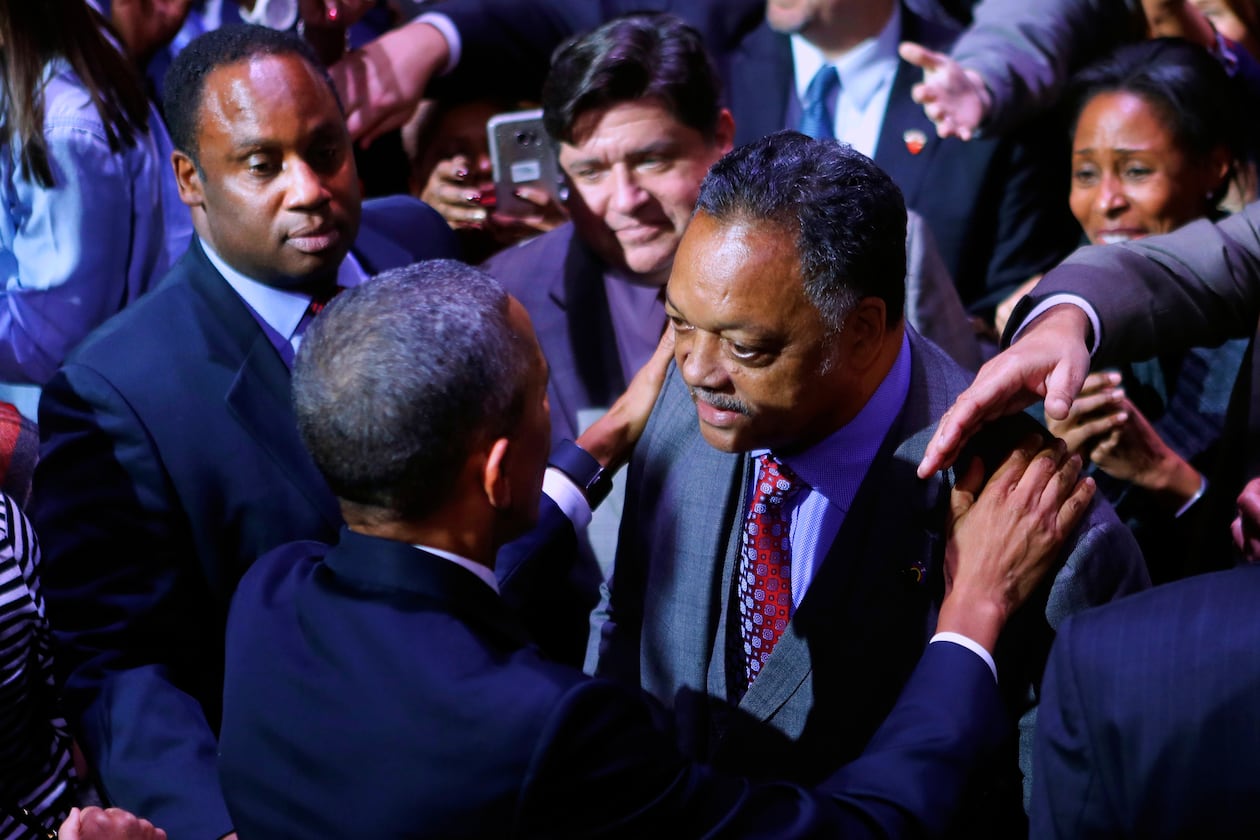 President Barack Obama talks with Rev. Jesse Jackson following his farewell address at McCormick Place in Chicago, Jan. 10, 2017. On the left is Jackson's son Jonathan Jackson. (Pablo Martinez Monsivais/AP)