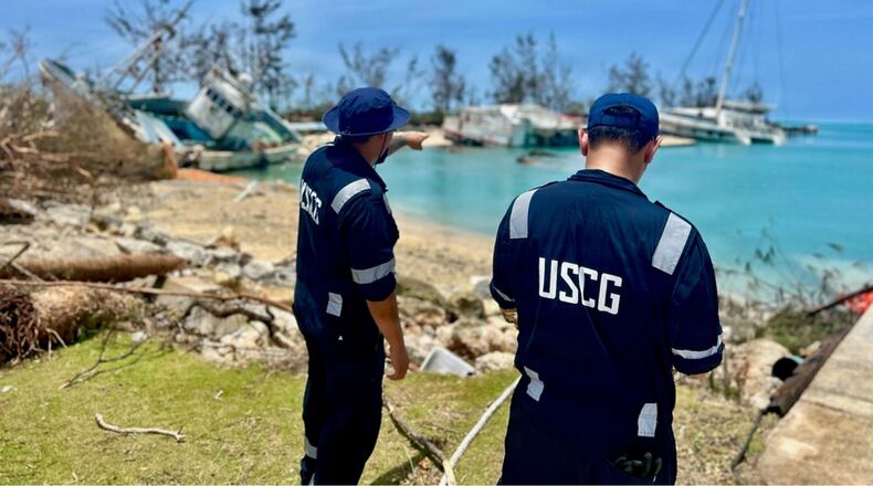 This photo provided by the U.S. Coast Guard , U.S. Coast Guard responders assess Smiling Cove in Saipan on April 18, 2026. (Lt. Whip Blacklaw/U.S. Coast Guard via AP)
