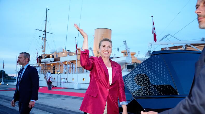 Acting Prime Minister Mette Frederiksen, center, waves on the royal ship Dannebrog on Monday, June 1, 2026, as the royal ship Dannebrog is docked at Odense Harbor. (Sebastian Elias Uth/Ritzau Scanpix via AP)