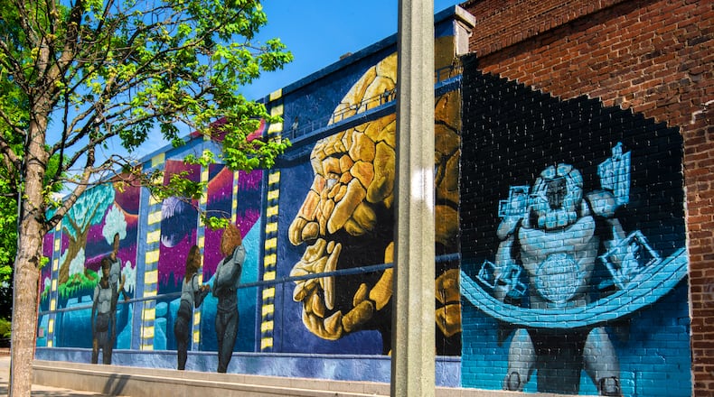 Tim Short's mural "Earthseed" at Squash Blossom Boutique. (Brock Scott/On The Grid).