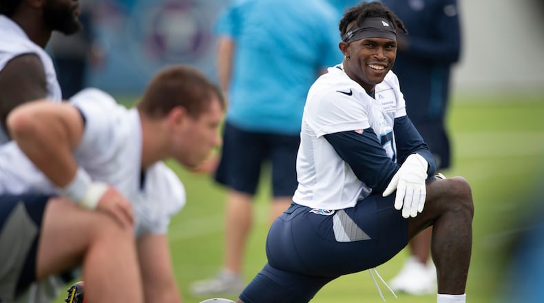 Tennessee Titans wide receiver Julio Jones stretches during NFL football practice Thursday, June 10, 2021, in Nashville, Tenn.
