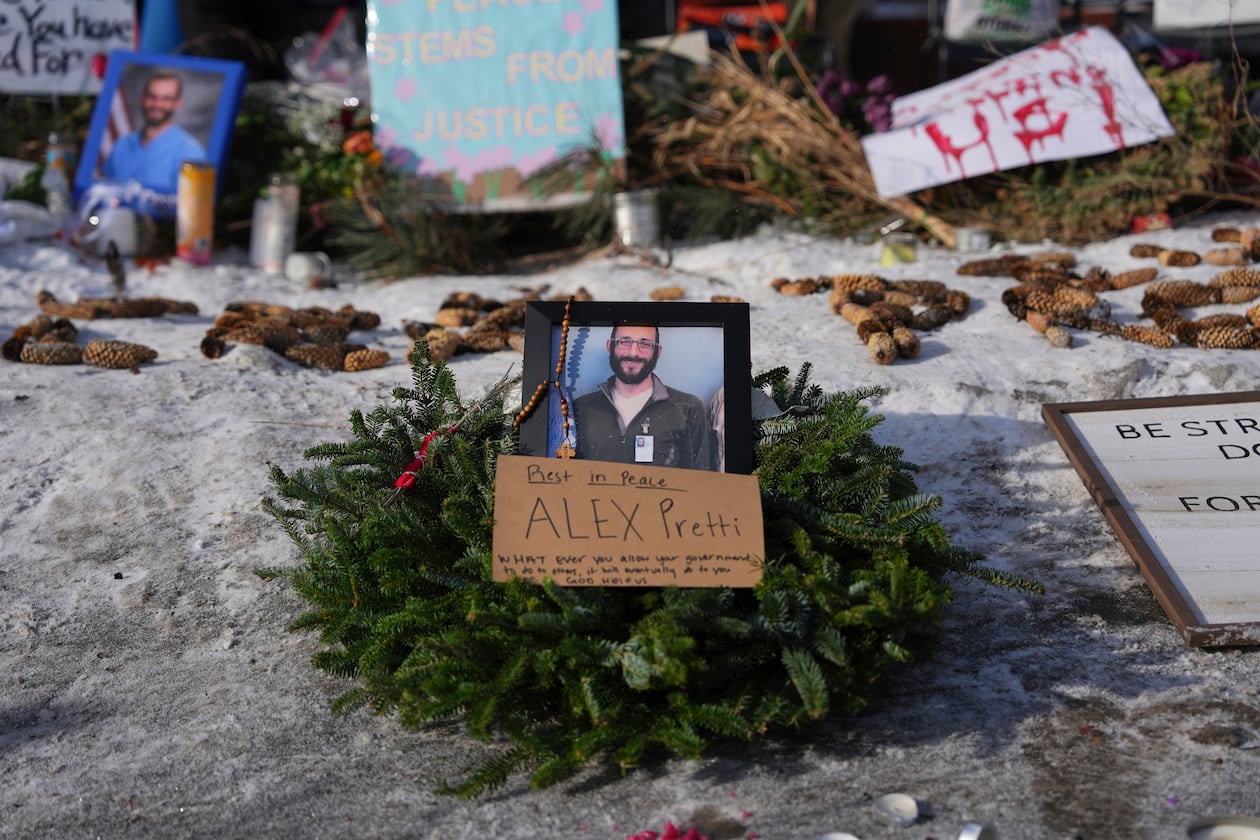 A makeshift memorial is placed where Alex Pretti was fatally shot by a U.S. Border Patrol officer yesterday, in Minneapolis, Sunday, Jan. 25, 2026. (Adam Gray/AP)